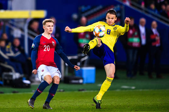 Martin Ødegaard of Norway and Albin Ekdal of Sweden