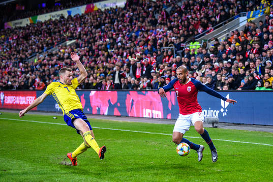 Sebastian Larsson of Sweden and Haitam Aleesami of Norway