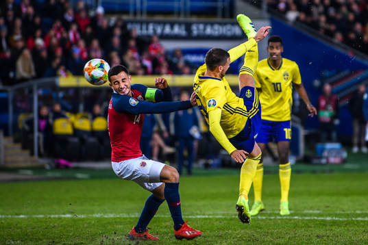 Omar Elabdellaoui of Norway and Marcus Berg of Sweden looks