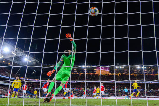 Robin Quaison of Sweden scores the 2-2 goal behind