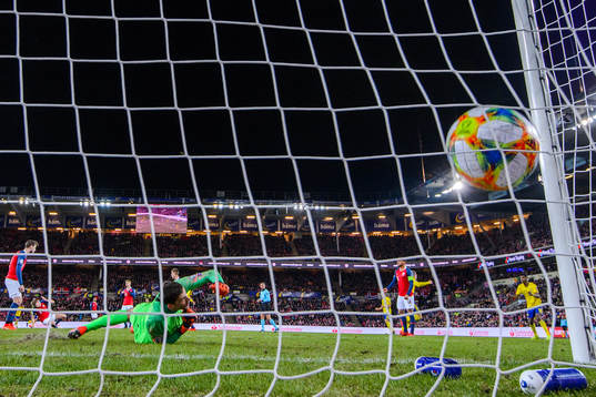 Robin Quaison of Sweden scores the 2-2 goal behind
