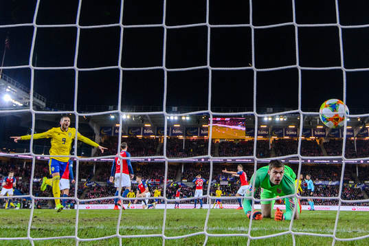 Robin Quaison of Sweden scores the 2-2 goal behind
