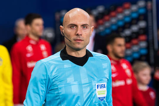 Assistans referee Alberto Tegoni of Italy