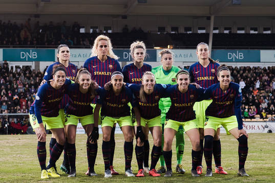 Players of Barcelona pose for a team group photo