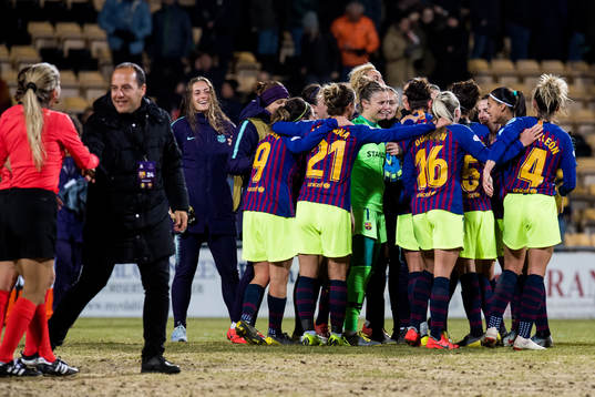 Lluis Cortes, coach, and the players of Barcelona celebrate