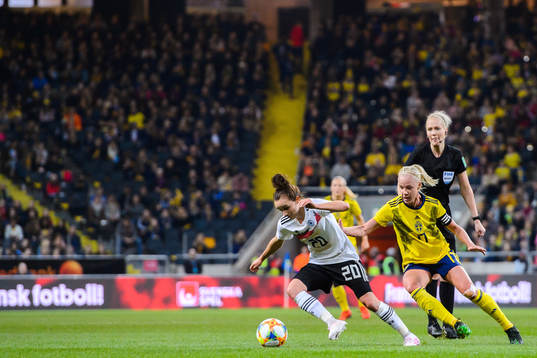 Lina Magull of Germany and Caroline Seger of Sweden
