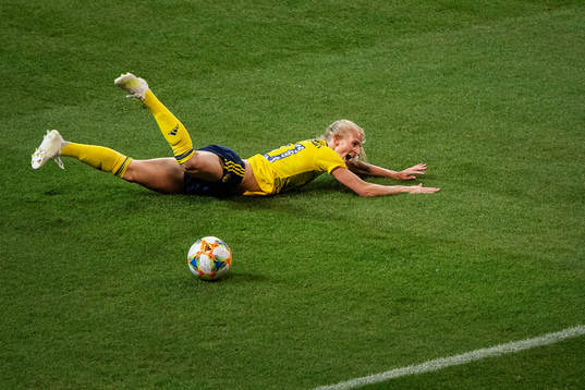 Sofia Jakobsson of Sweden falls in the penalty area