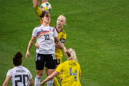Dzsenifer Marozsan of Germany and Caroline Seger of Sweden
