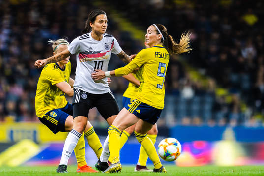 Dzsenifer Marozsan of Germany and Kosovare Asllani of Sweden