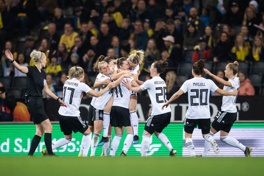 Kathrin Hendrich of Germany celebrates with teammates