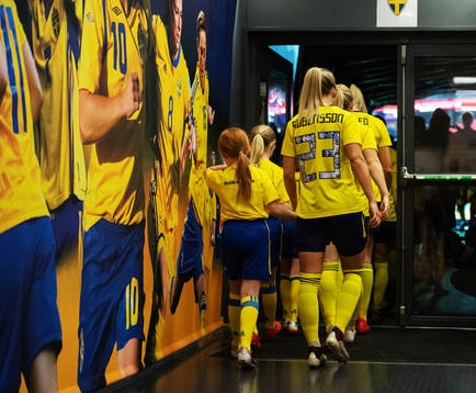 Elin Rubensson of Sweden enter the field in hand with a