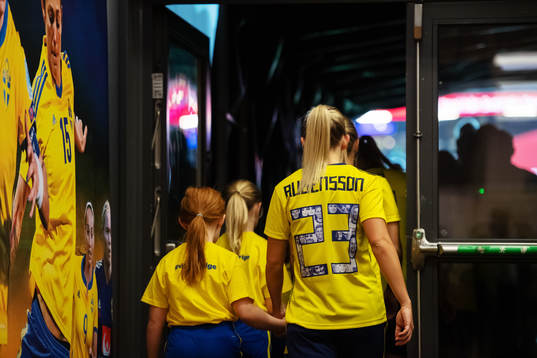 Elin Rubensson of Sweden enter the field in hand with a