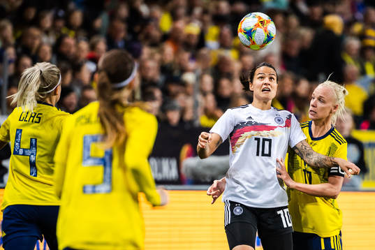 Dzsenifer Marozsan of Germany and Caroline Seger of Sweden
