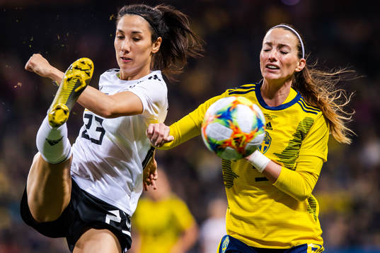 Sara Doorsoun of Germany and Kosovare Asllani of Sweden