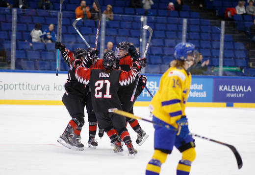 Team Japan players celebrating winning goal against Sweden