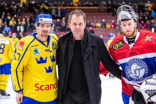 Emil Djuse of Sweden and goalkeeper Henrik Haukeland of