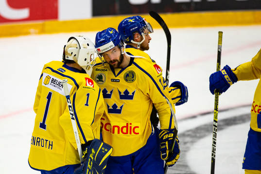 goalkeeper Jhonas Enroth and Simon Bertilsson of Sweden