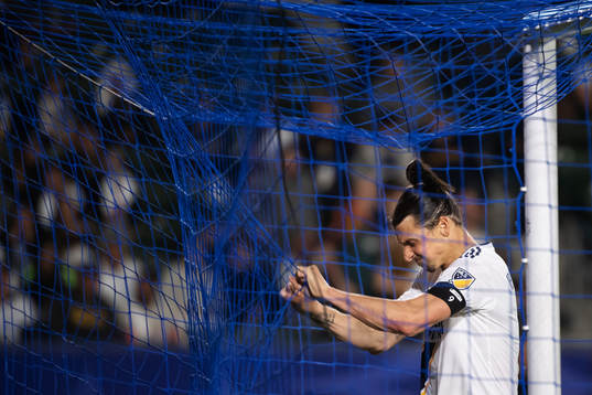 Zlatan Ibrahimovic of LA Galaxy rips the net of a goal