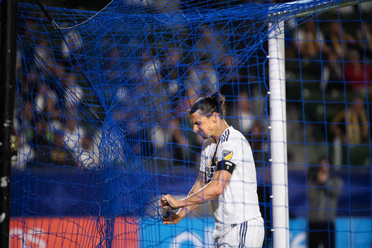 Zlatan Ibrahimovic of LA Galaxy rips the net of a goal
