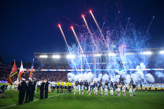 Fireworks behind the players in conjunction with the