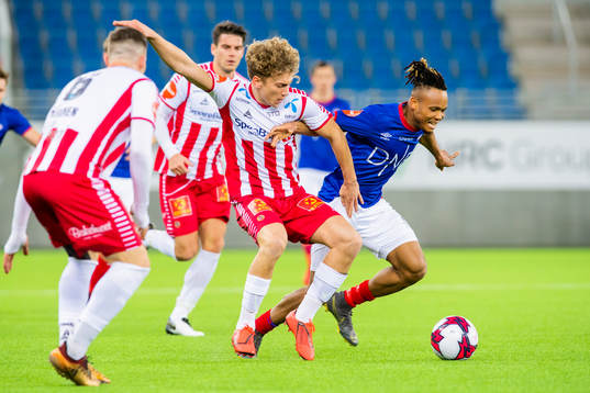 Tomas Stabell of Tromsø and Chidera Ejuke of Vålerenga