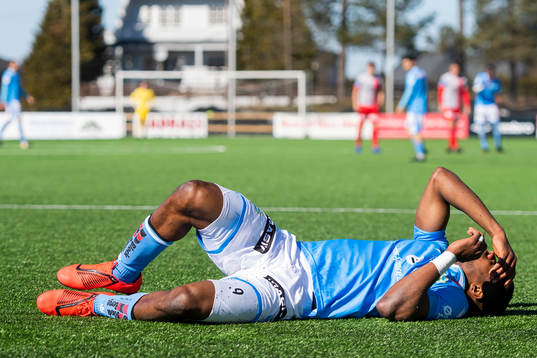 Kachi of Sandnes Ulf lies down with an injury