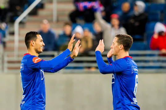 Deyver Vega and Herolind Shala of Vålerenga celebrate
