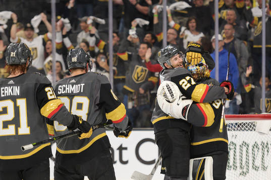 Shea Theodore hugs Marc-Andre Fleury of Vegas Golden Knights