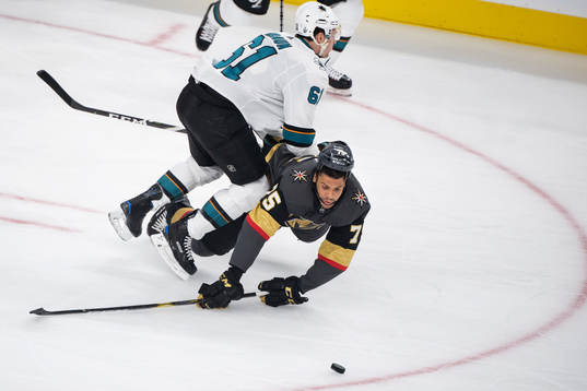 Justin Braun of San Jose Sharks tackles Ryan Reaves of