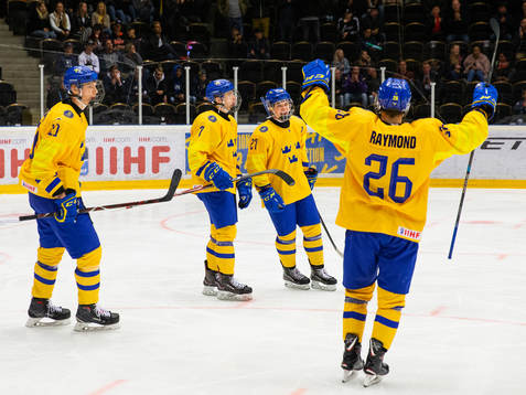 Tobias Björnfot and Alexander Holtz of Sweden celebrate