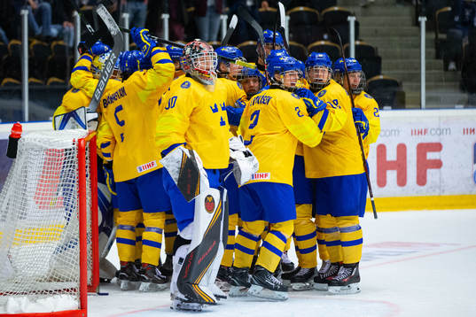 Players of Sweden celebrate