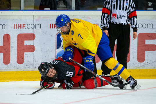 Tobias Björnfot of Sweden and Connor Zary of Canada