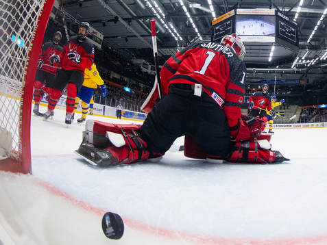 Sweden scores behind Taylor Gauthier of Canada