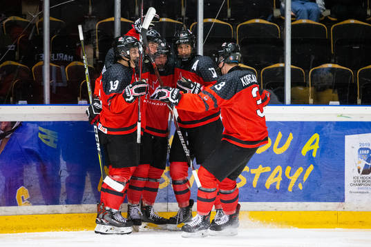 Alex Newhook of Canada celebrate with team mates