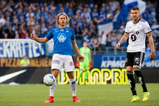 Martin Bjørnbak of Molde and Nicklas Bendtner of Rosenborg