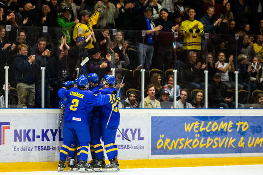 Lucas Raymond of Sweden celebrates with teammates