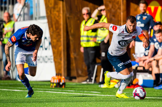 Jørgen Olsen Øveraas of Ranheim and Zlatko Tripic of