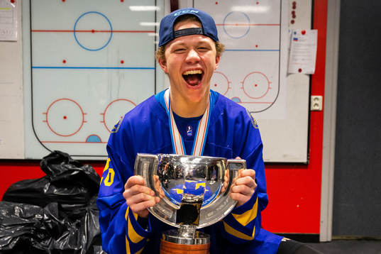 Lucas Raymond of Sweden celebrates with the trophy