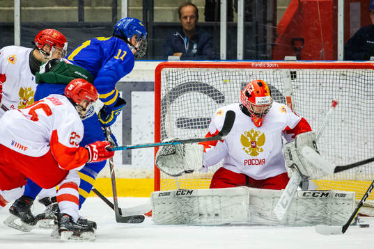 Elmer Söderblom of Sweden  and goalkeeper Yaroslav Askarov