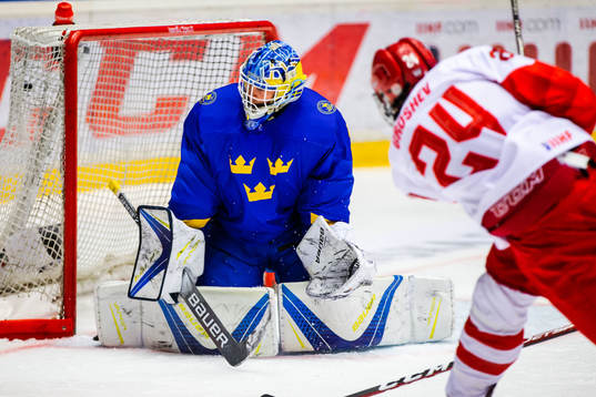 Maxim Groshev of Russia scores 2-3 behind goalkeeper Hugo