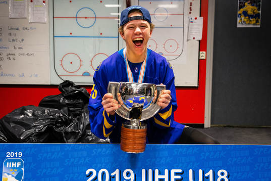 Lucas Raymond of Sweden celebrates with the trophy