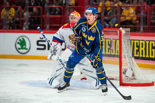 Goalkeeper Andrei Vasilevsky of Russia and Oskar Lindblom
