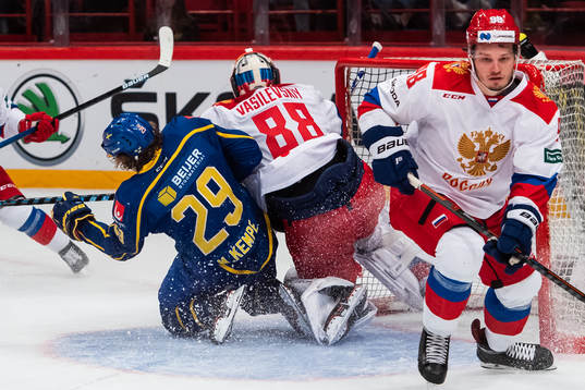 Mario Kempe of Sweden and goalkeeper Andrei Vasilevsky of