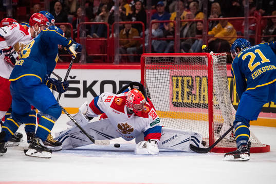 Anton Lander and Loui Eriksson against goalkeeper Andrei