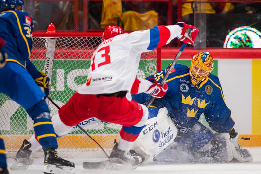 Sergei Andronov of Russia scores 3-2 behind goaltenderJacob