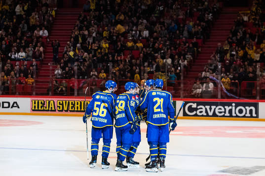 Mario Kempe of Sweden celebrates with team mates