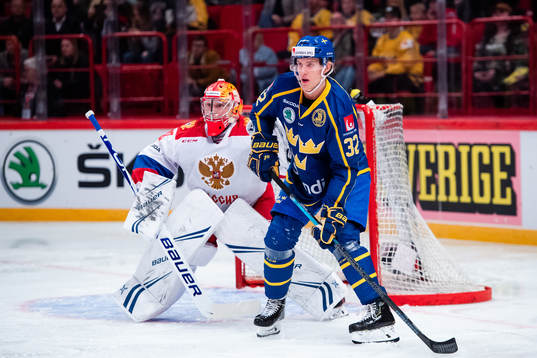 goalkeeper Andrei Vasilevsky of Russia and Oskar Lindblom