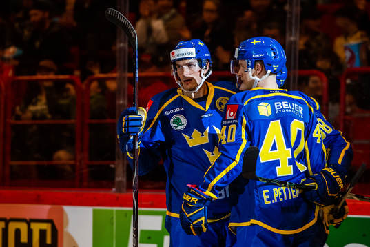 Loui Eriksson celebrate with Elias Pettersson of Sweden