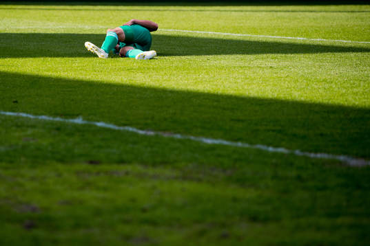 Jo Sondre Aas of Nest-Sotra lies down in the penalty area