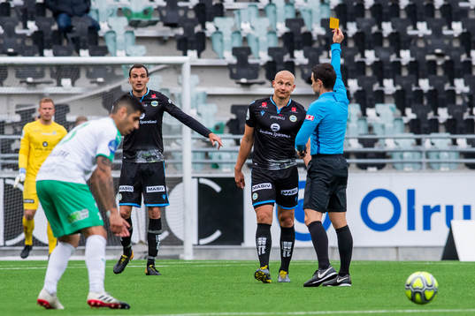 Johannes Laaksonen of Sandnes Ulf is shown a yellow card by
